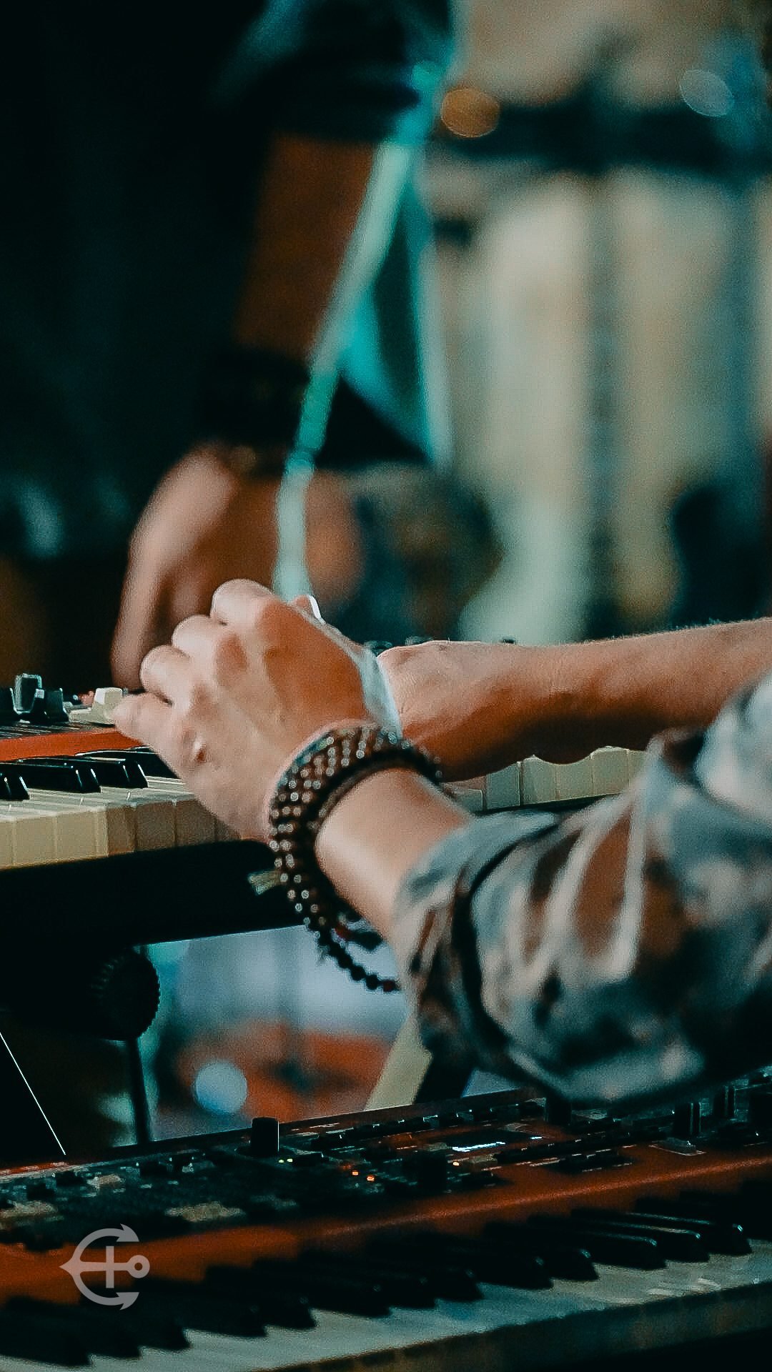 Close detail of a musician playing keyboard
