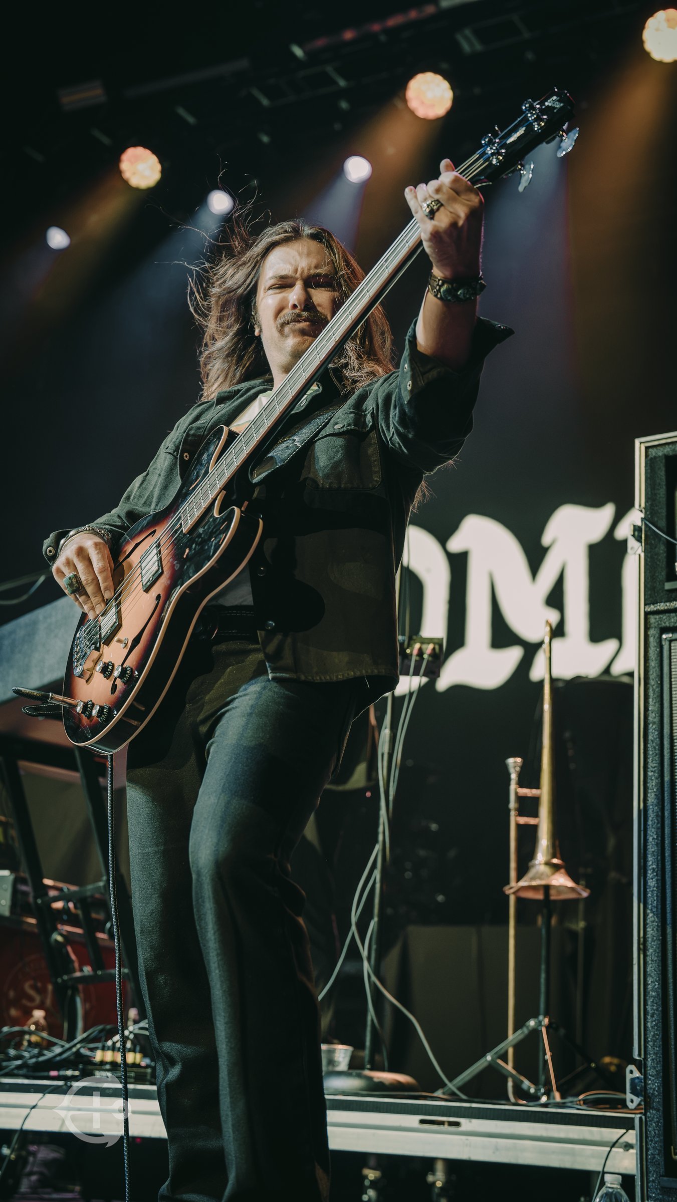 Adam, bass player for ROME, performing at The Pinnacle in Nashville