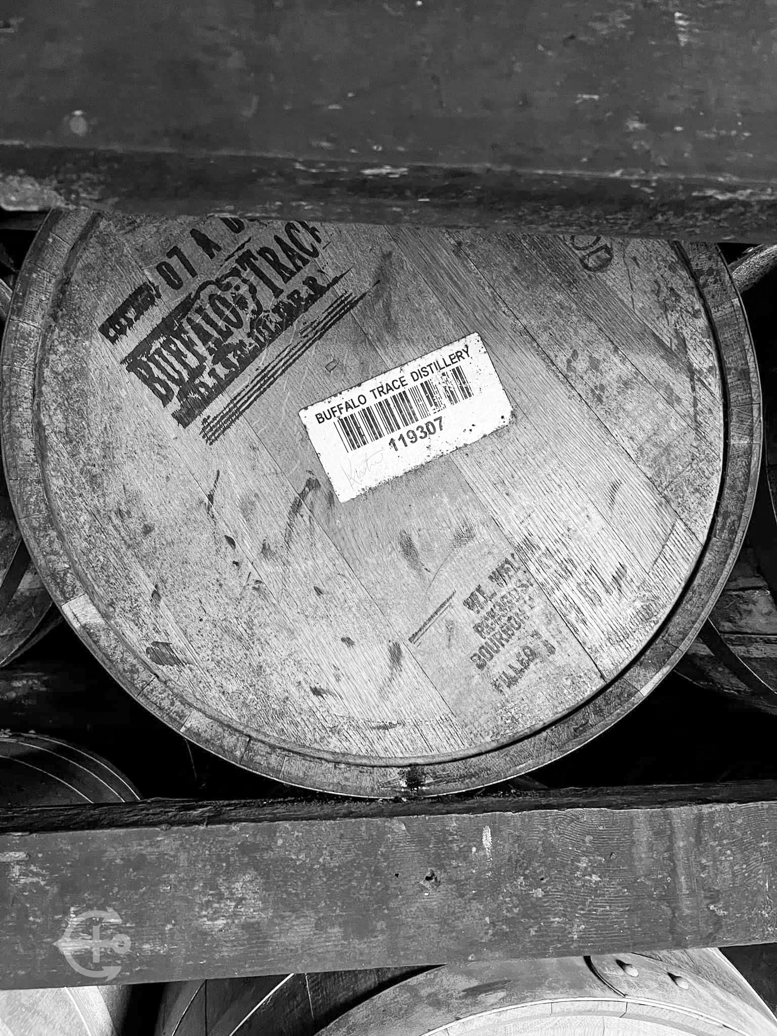 Black-and-white detail of a marked whiskey barrel