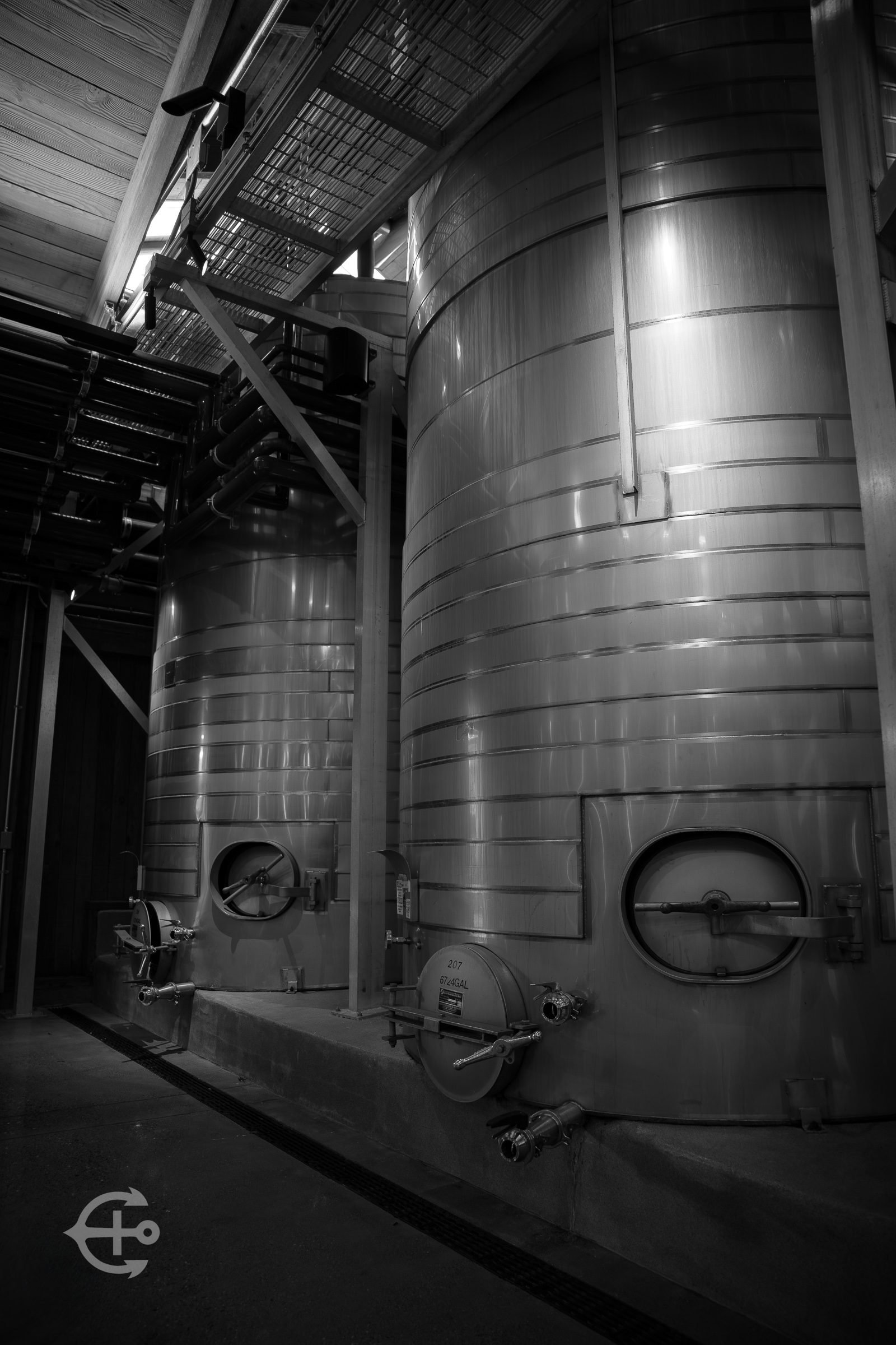 Black-and-white industrial tanks and piping