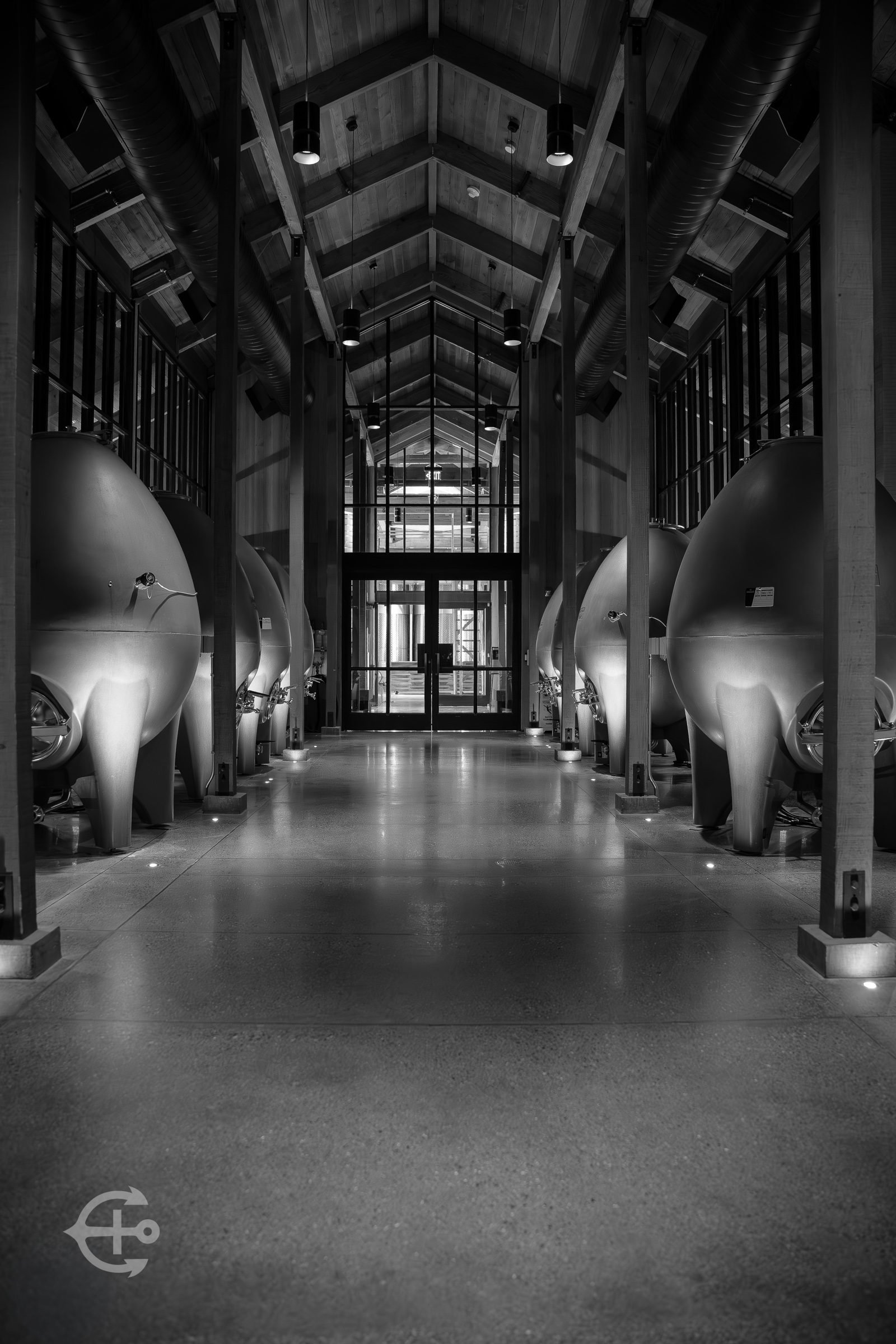 Symmetrical black-and-white interior of an industrial hall
