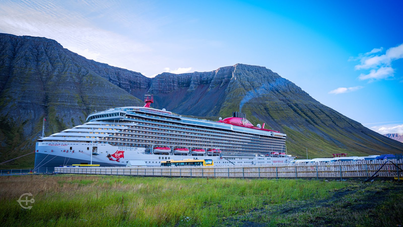 Valiant Lady docked beneath steep mountains in Ísafjörður